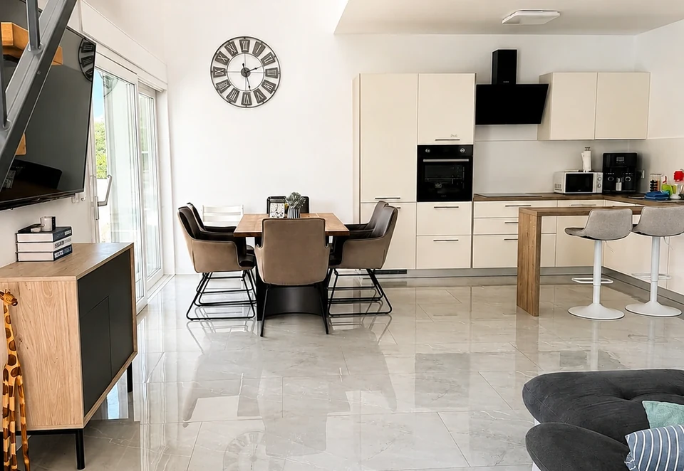Open-plan living room and kitchen at Villa Julija