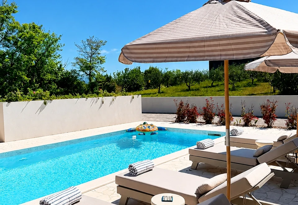 Poolside sun loungers at Villa Julija
